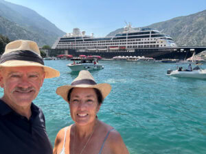 The writer and her husband in front of the Azamara Pursuit
