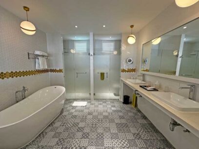 Overwater villas come with a huge bathroom with soaking tub. Photo by Janna Graber