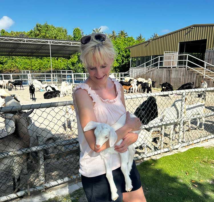 The author holding a baby goat at Siyam World in the Maldives. Photo courtesy Janna Graber