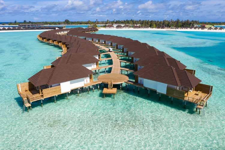 Overwater villas in the Maldives at Sun Siyam Olhuveli. Photo by Sun Siyam Resorts
