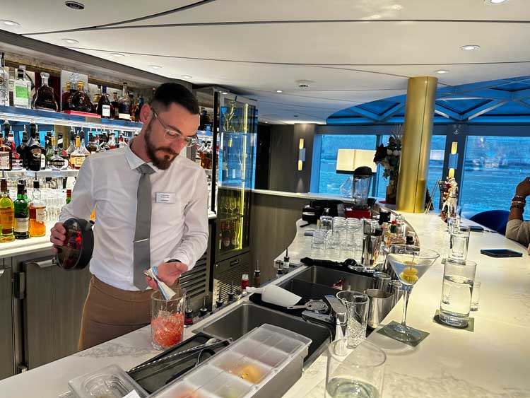 Bartender making a drink on the Riverside Debussy