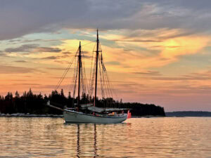 The American Eagle, a Maine Windjammer, at sunset in Maine. Photo by Janna Graber