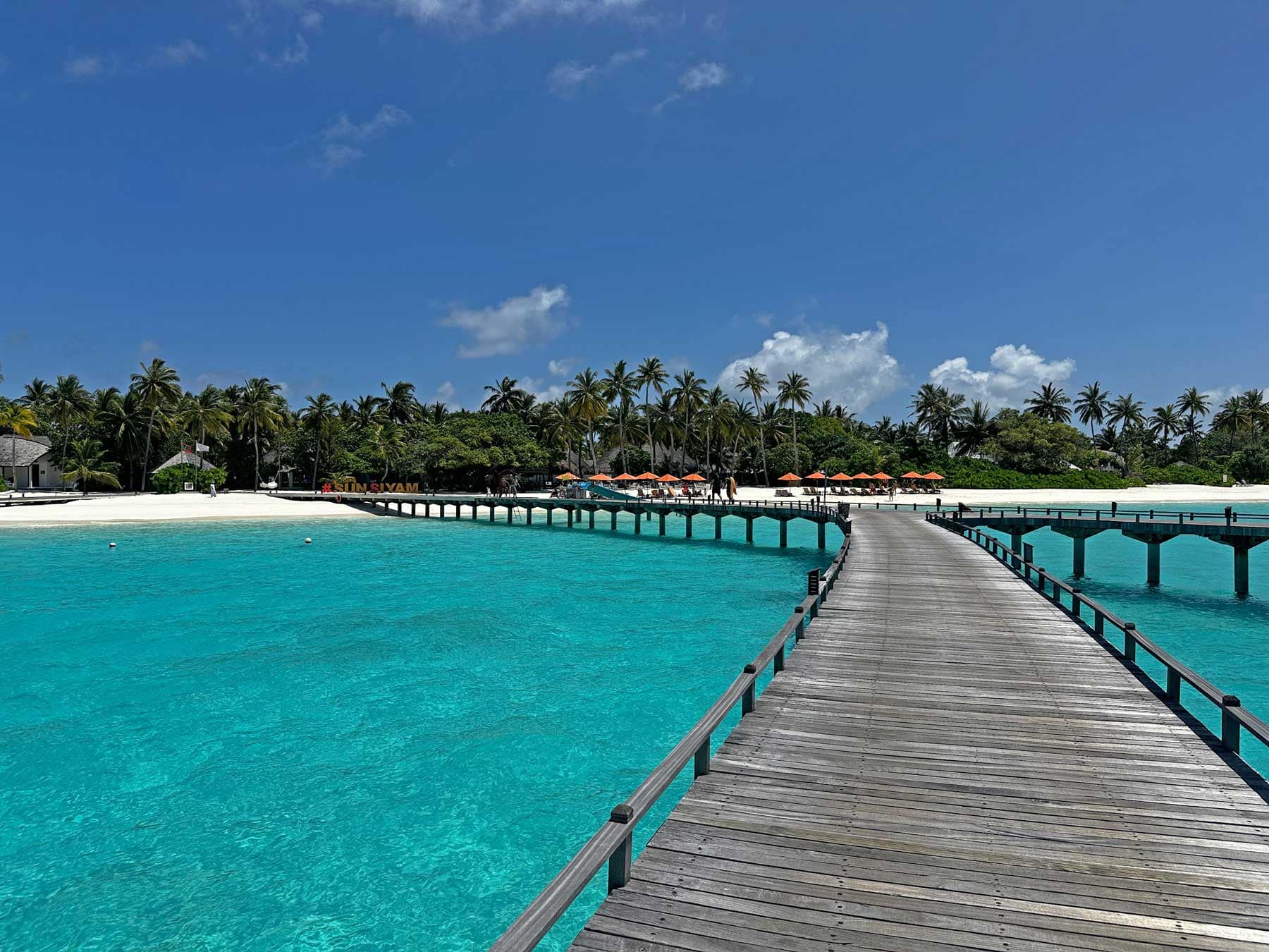 Walkway over crystal blue sea in the Maldives